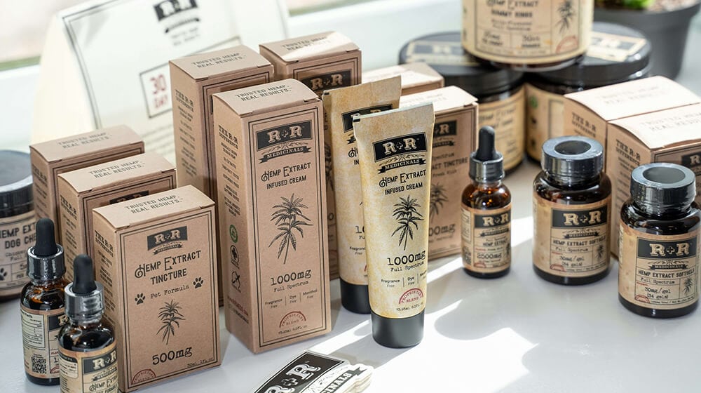 a group of CBD tinctures & tincture packaging kraft boxes