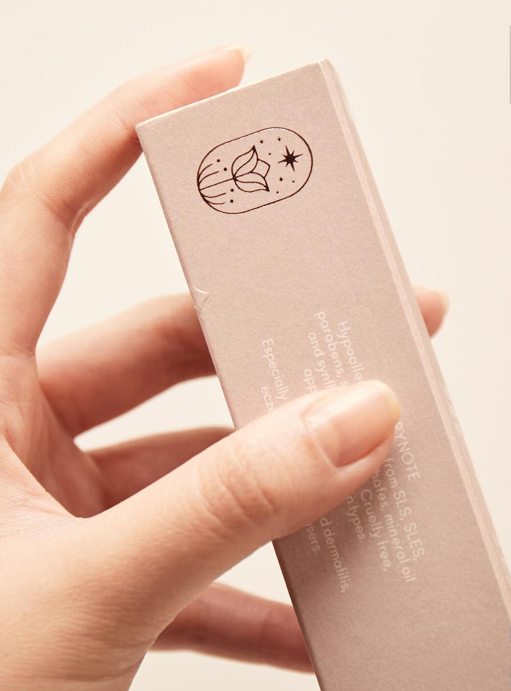 a full-color printing folding carton made with white kraft paper and emboss & gold foil LOGO