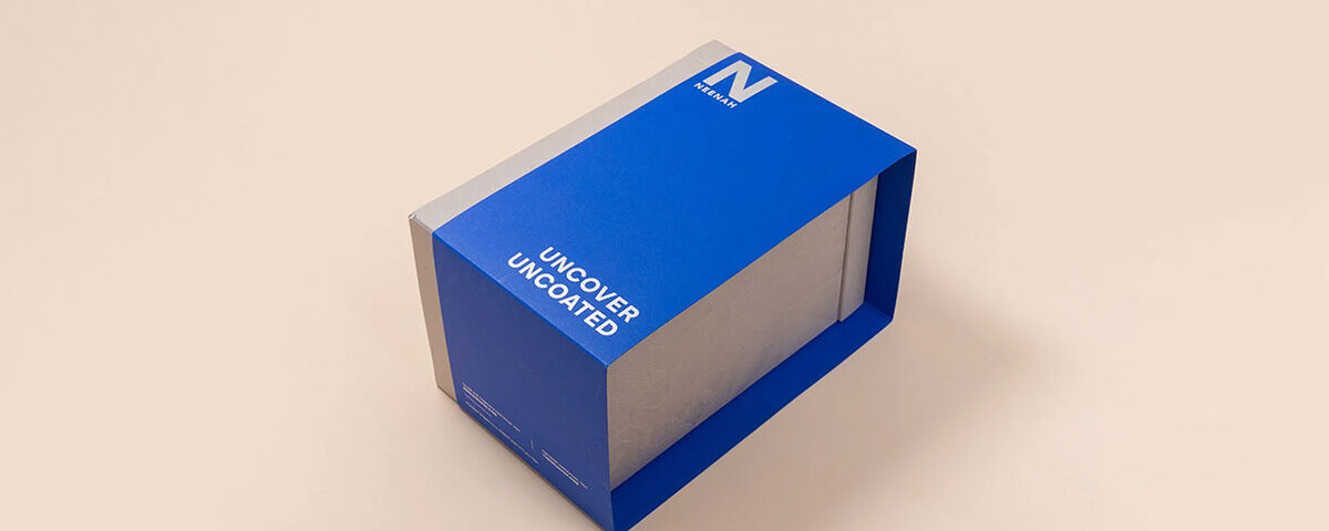 Blue and silver uncoated cardboard sleeve packaging box with bold branding