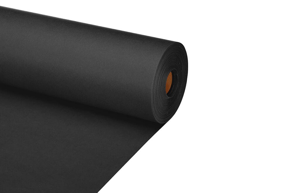 a roll of black kraft paper showing the raw paper texture