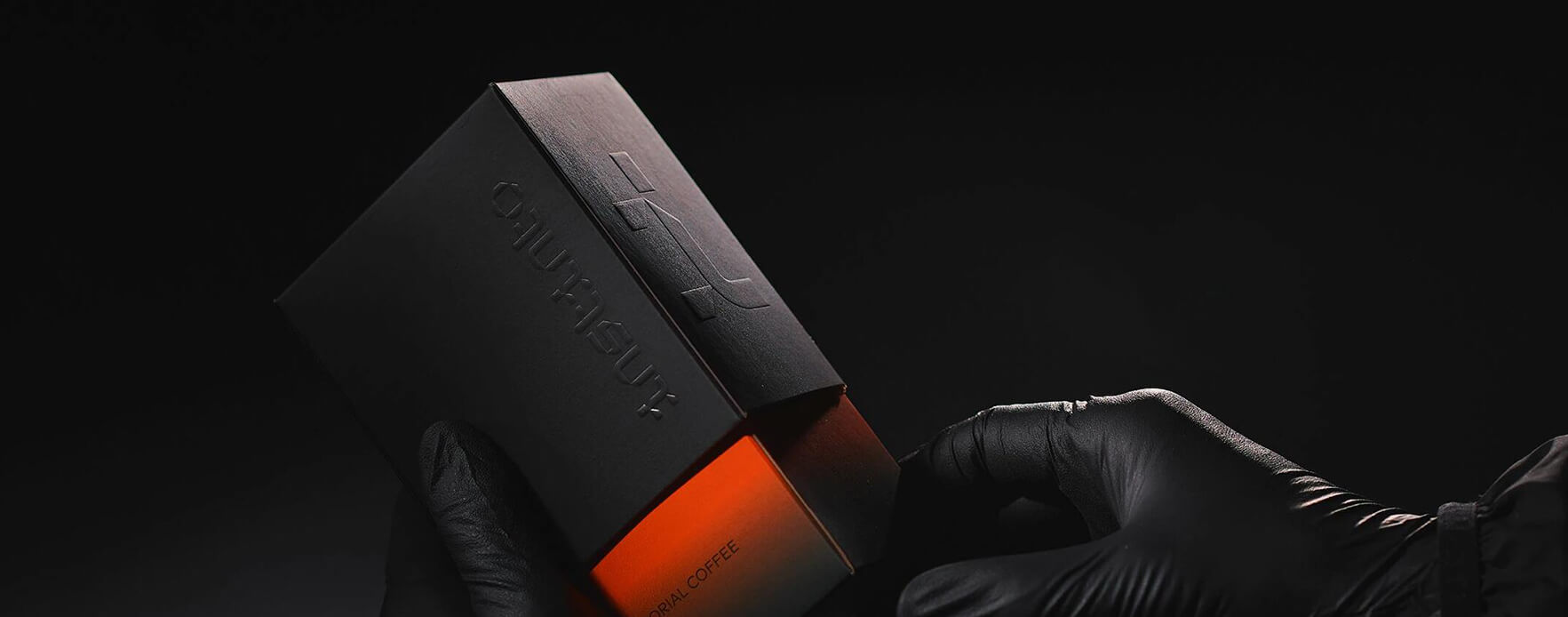 a luxurious black gift box made of black kraft paper and embossed LOGO