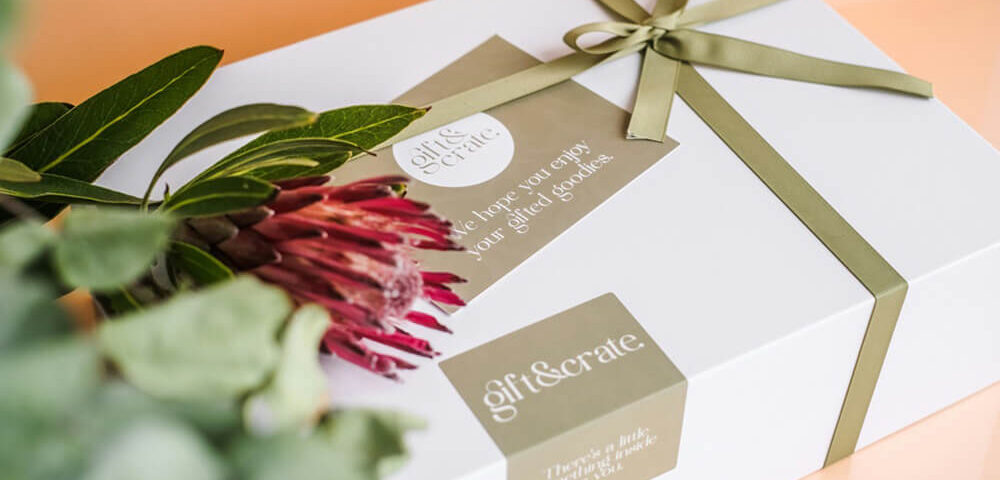 Elegant white gift box with ribbon and flower arrangement for cannabis packaging