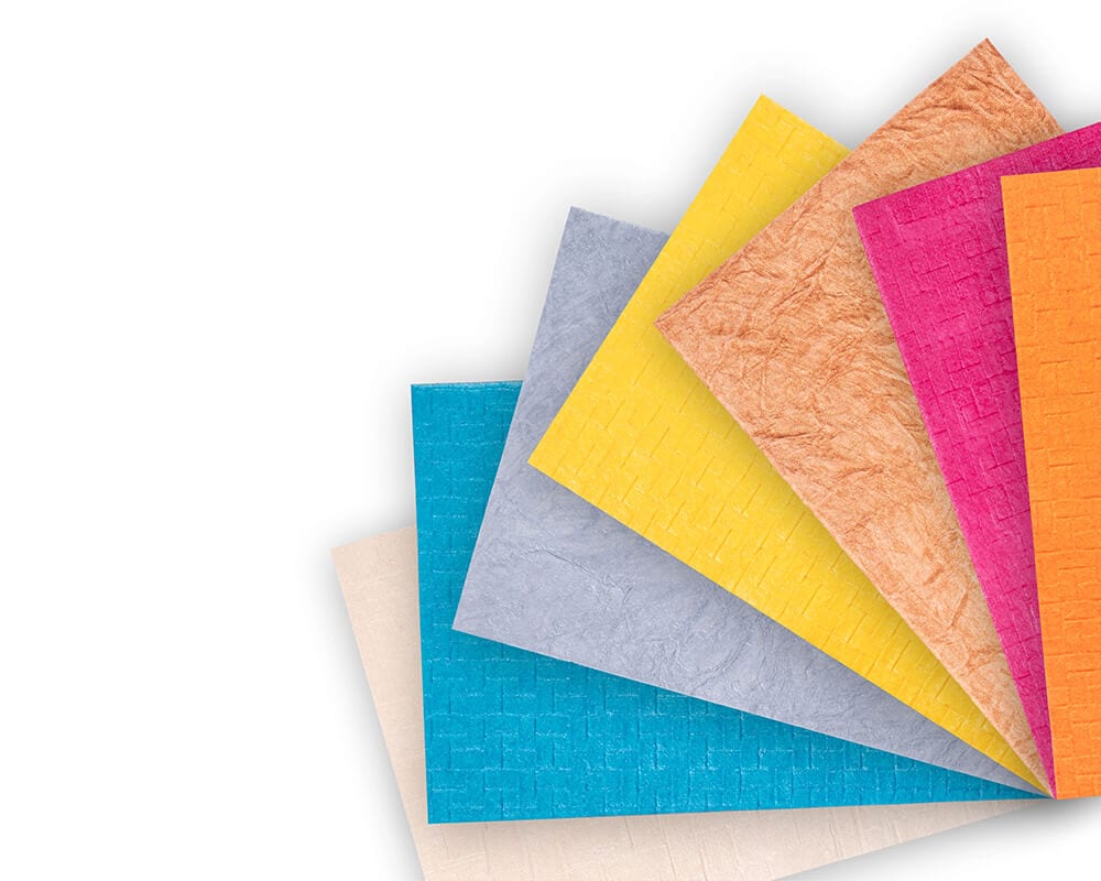 several pieces of textured paper in different colors