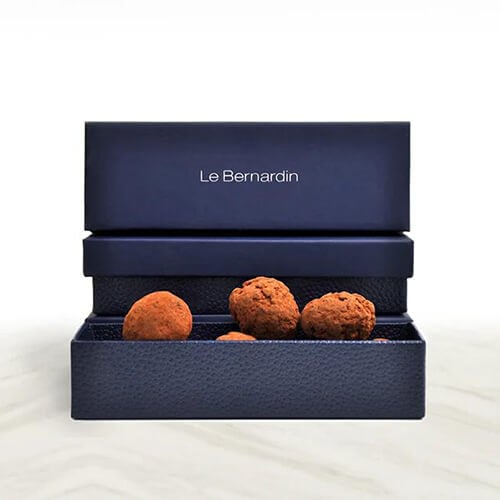 a blue textured paper box and some edibles