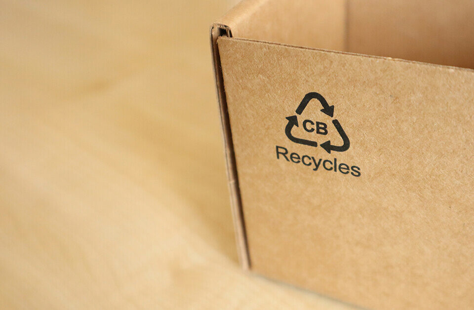 Recycled compostable cannabis packaging with recycling symbol