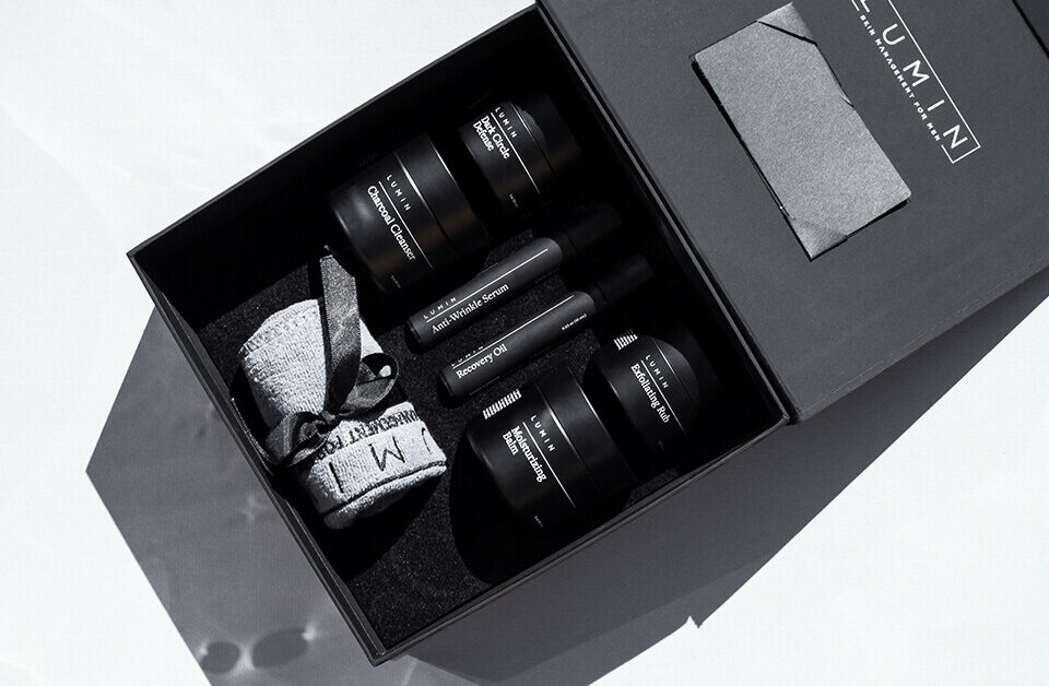 Black luxury gift box with foam insert showcasing skincare products