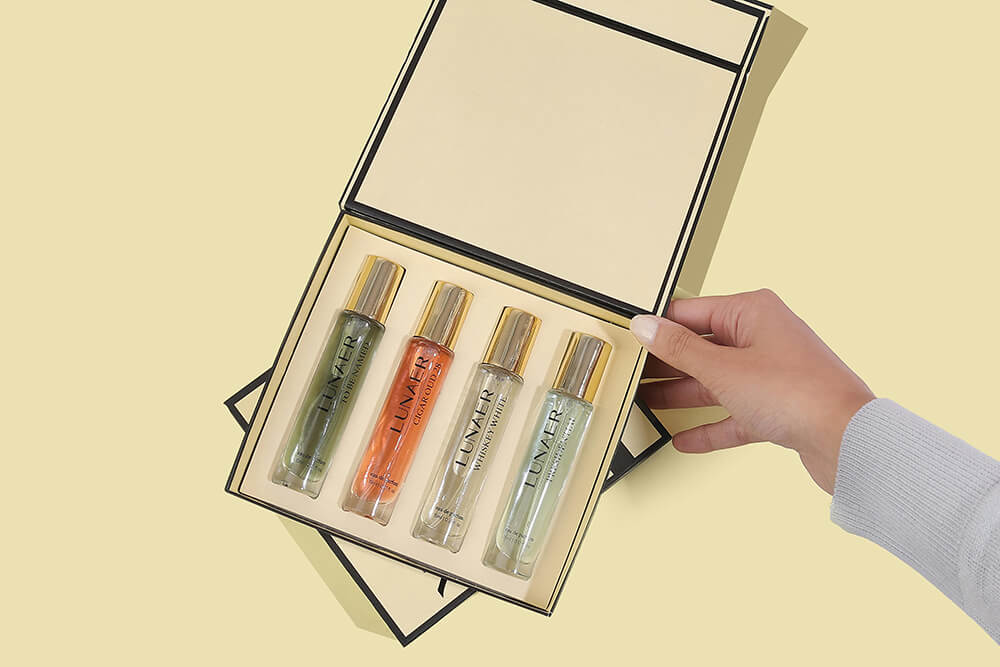 Cream-colored rigid box with foam insert and glass cannabis oil bottles