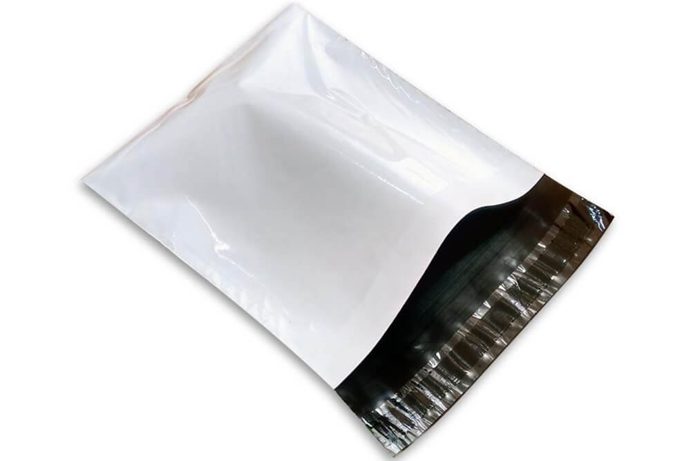 White opaque mailing bag with black sealing strip for discreet shipping.