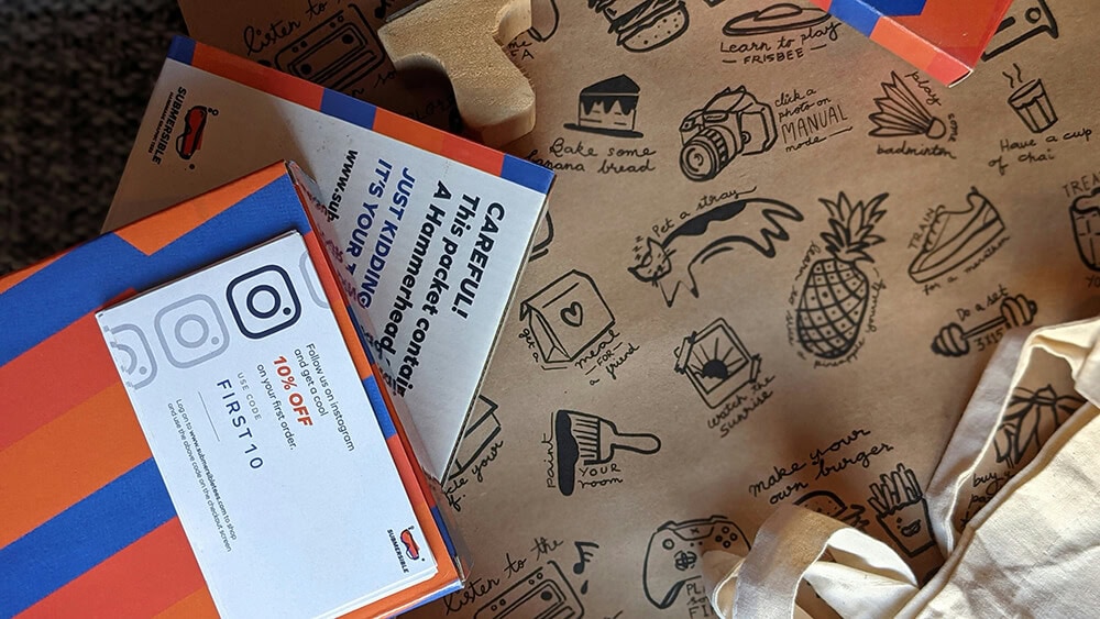 Discount coupon insert with Instagram branding in custom mailer box