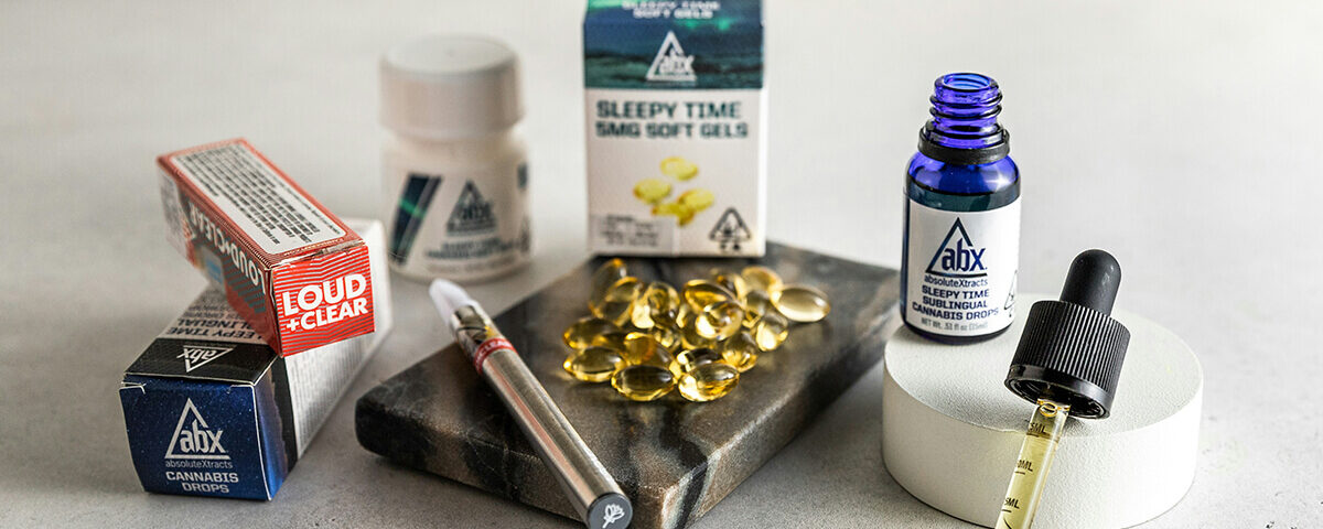 THC tincture products including capsules, dropper bottles, and cannabis packaging displayed together.