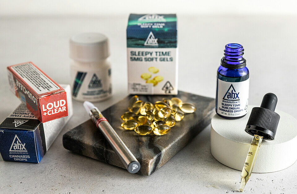 THC tincture products including capsules, dropper bottles, and cannabis packaging displayed together.