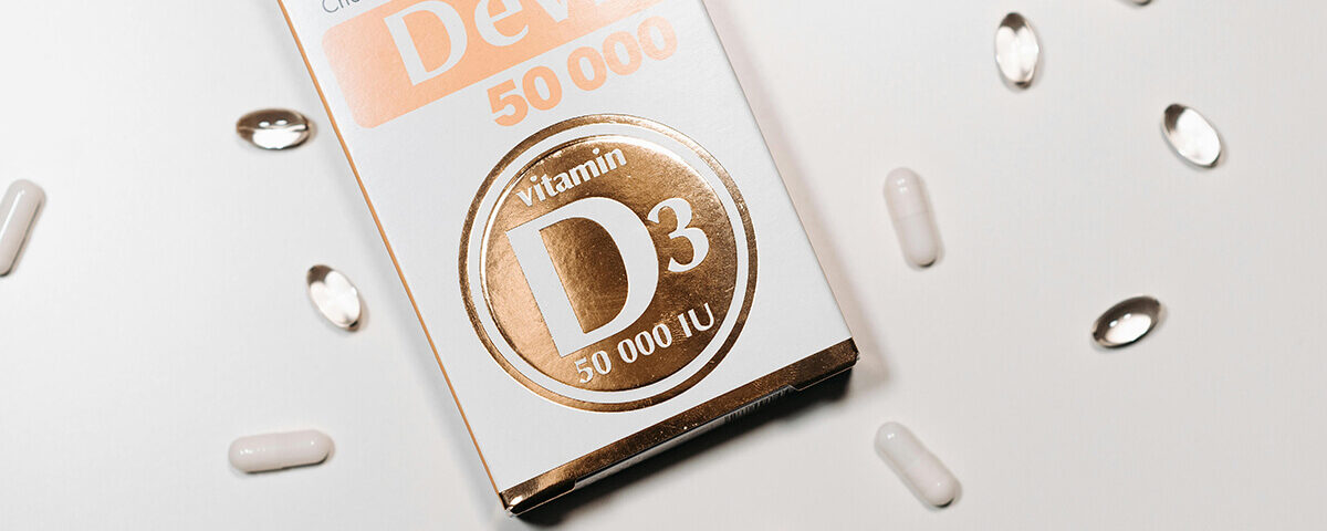 Vitamin D3 50,000 IU supplement pharmaceutical packaging design box with capsules.