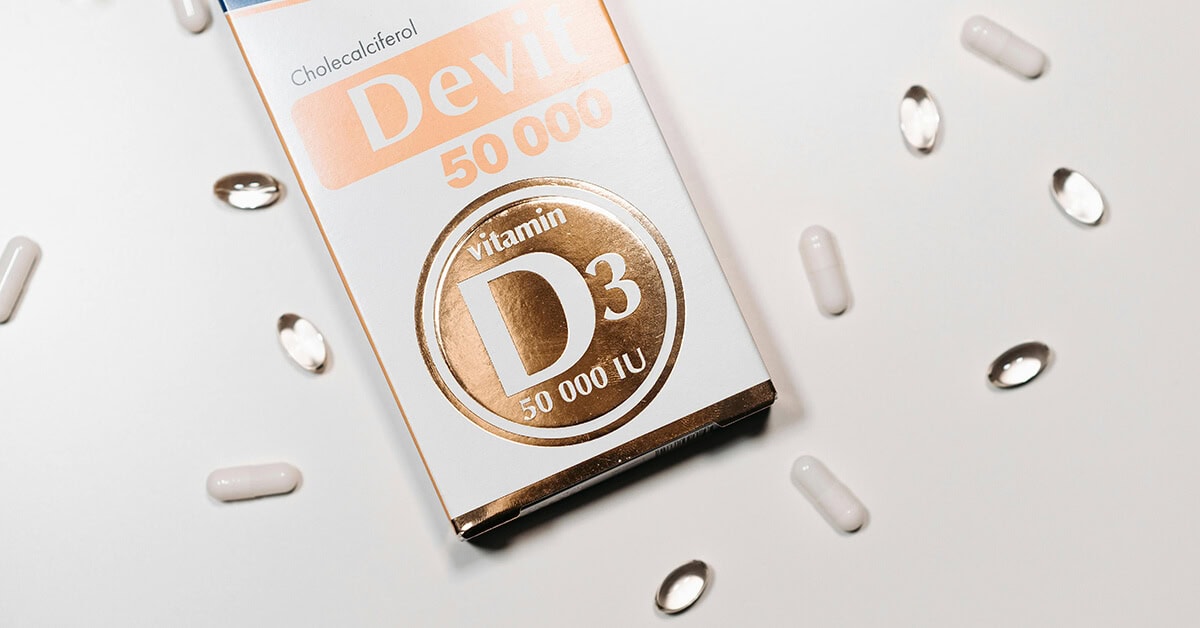 Vitamin D3 50,000 IU supplement pharmaceutical packaging design box with capsules.