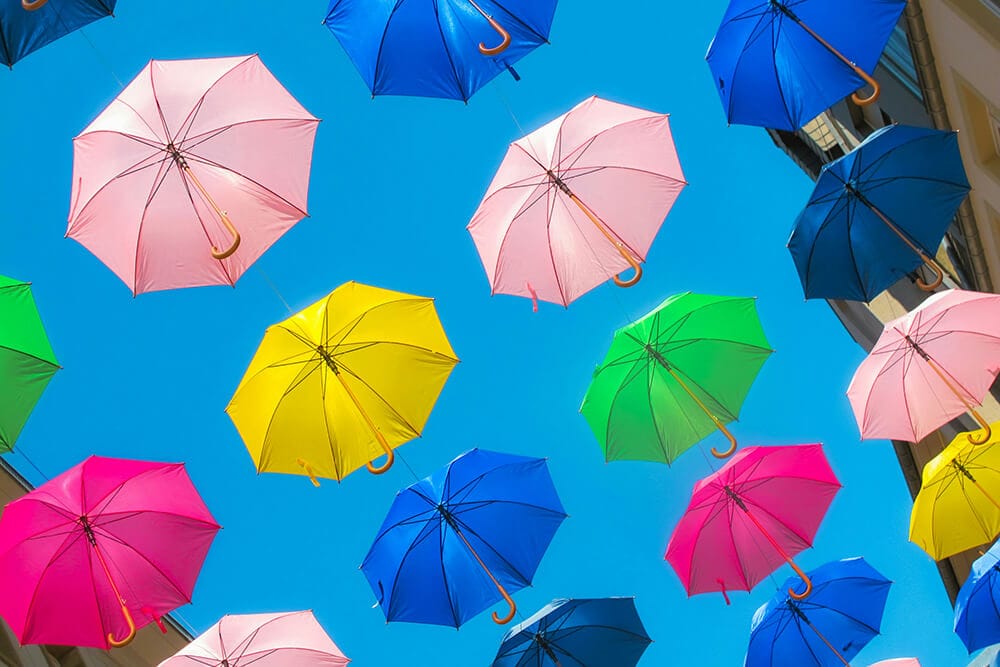 Colorful umbrellas representing vibrant RGB and CMYK printing outcomes