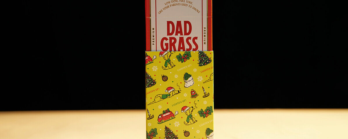 cannabis Holiday packaging with Dad Grass pre-roll pack in festive sleeve