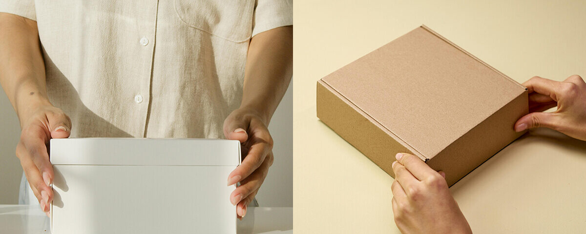 Brown and white kraft box packaging comparison held by hands