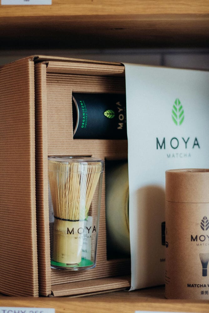 Moya Matcha cannabis packaging featuring custom cardboard design with eco-friendly materials and unique product compartments.