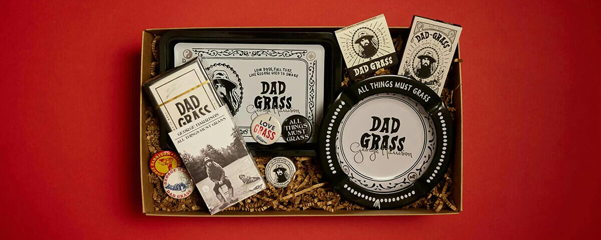 Premium cannabis gift set in custom product boxes with branded accessories on red background