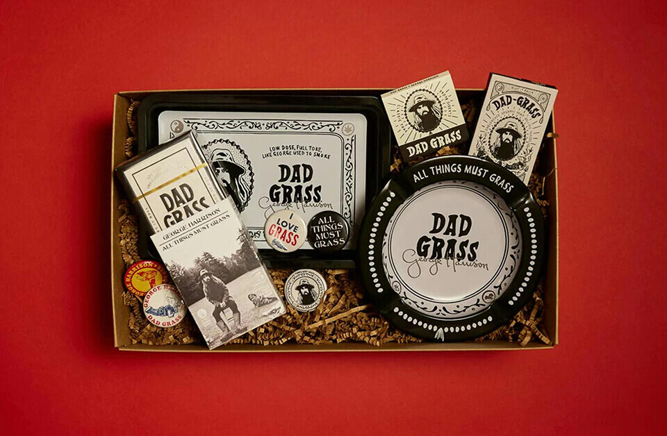 Premium cannabis gift set in custom product boxes with branded accessories on red background