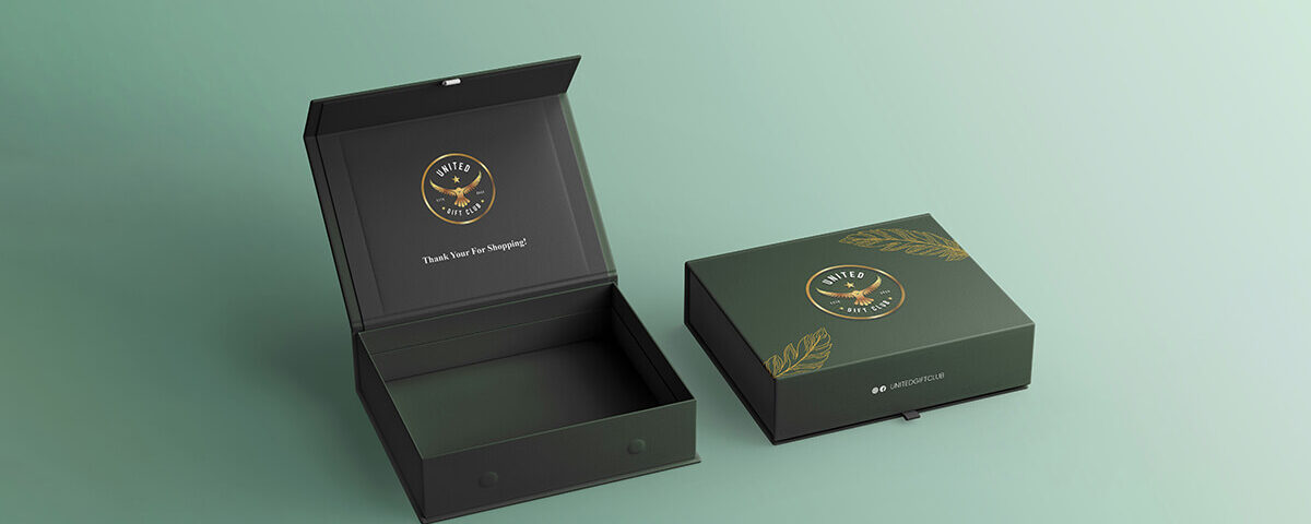 Opened custom made boxes featuring a thank you message inside and green design.