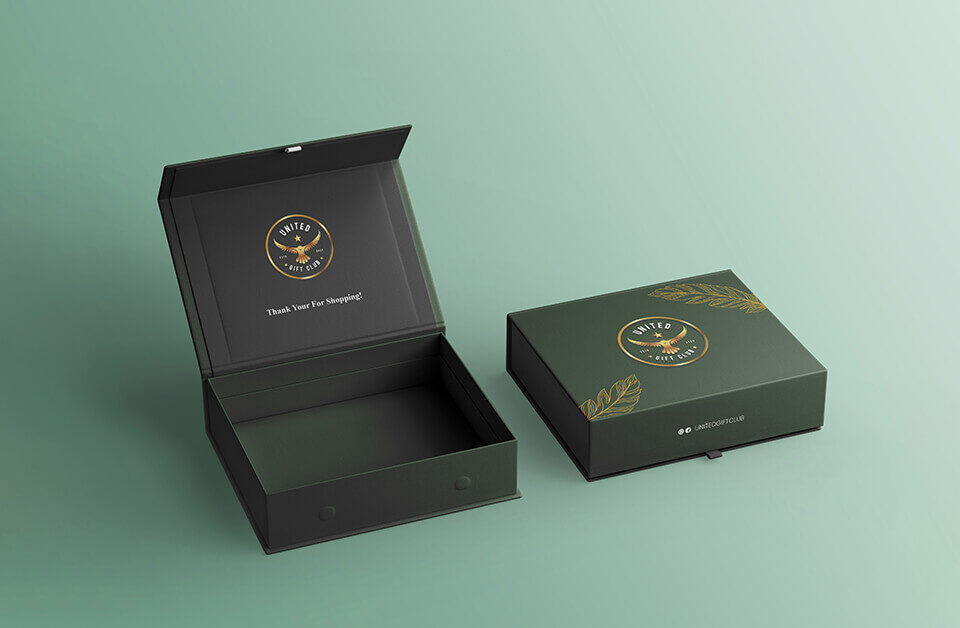 Opened custom made boxes featuring a thank you message inside and green design.