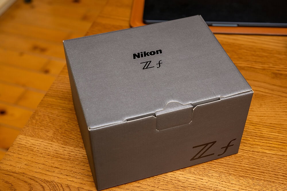 Nikon camera packaging in a sleek gray custom-made box.