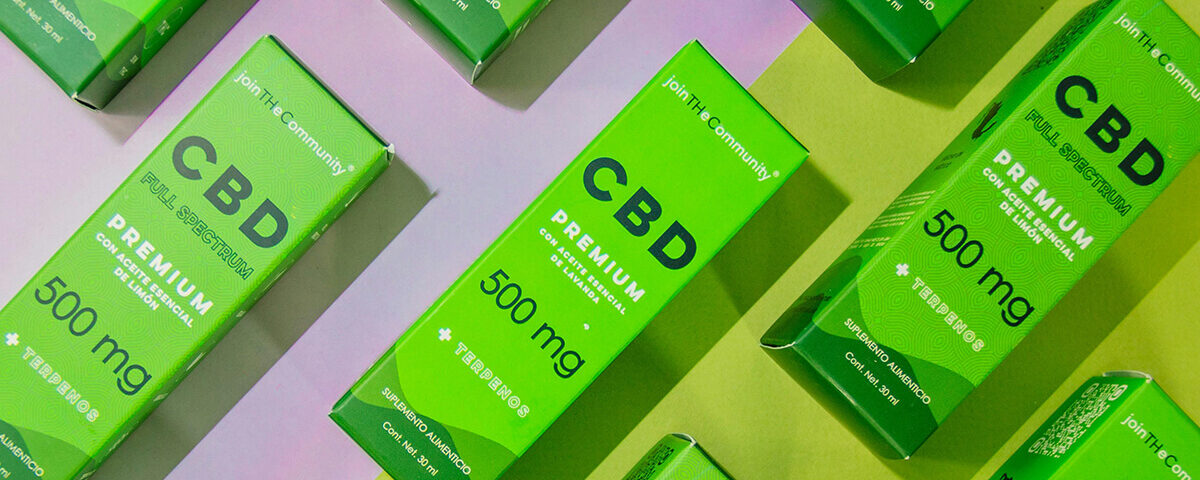 Custom CBD packaging in vibrant green custom tuck top boxes showcasing premium full-spectrum CBD products.