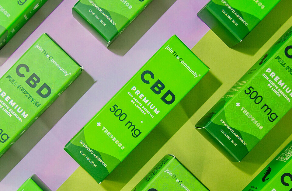 Custom CBD packaging in vibrant green custom tuck top boxes showcasing premium full-spectrum CBD products.