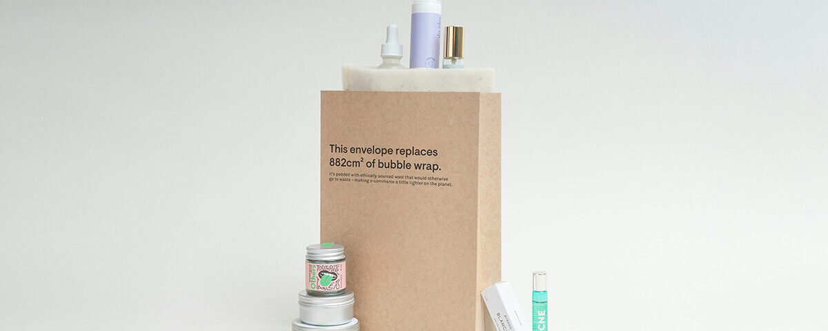 Eco-friendly kraft packaging padded mailer envelope holding cosmetic products