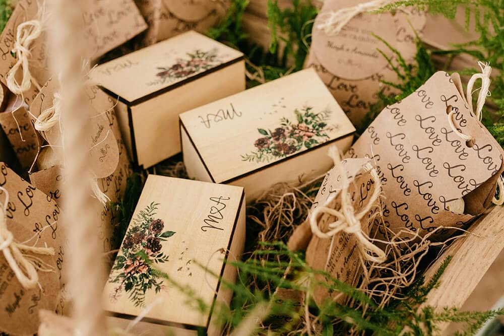 Rustic kraft gift packaging with floral designs arranged in a decorative display