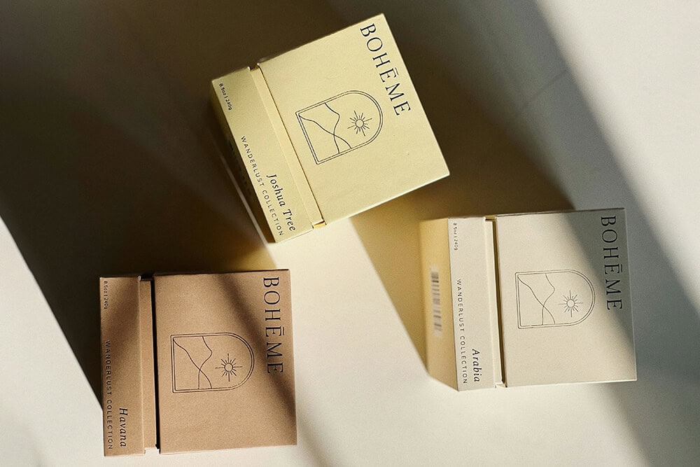 Minimalist luxury rigid box packaging for scented candles with soft neutral tones.