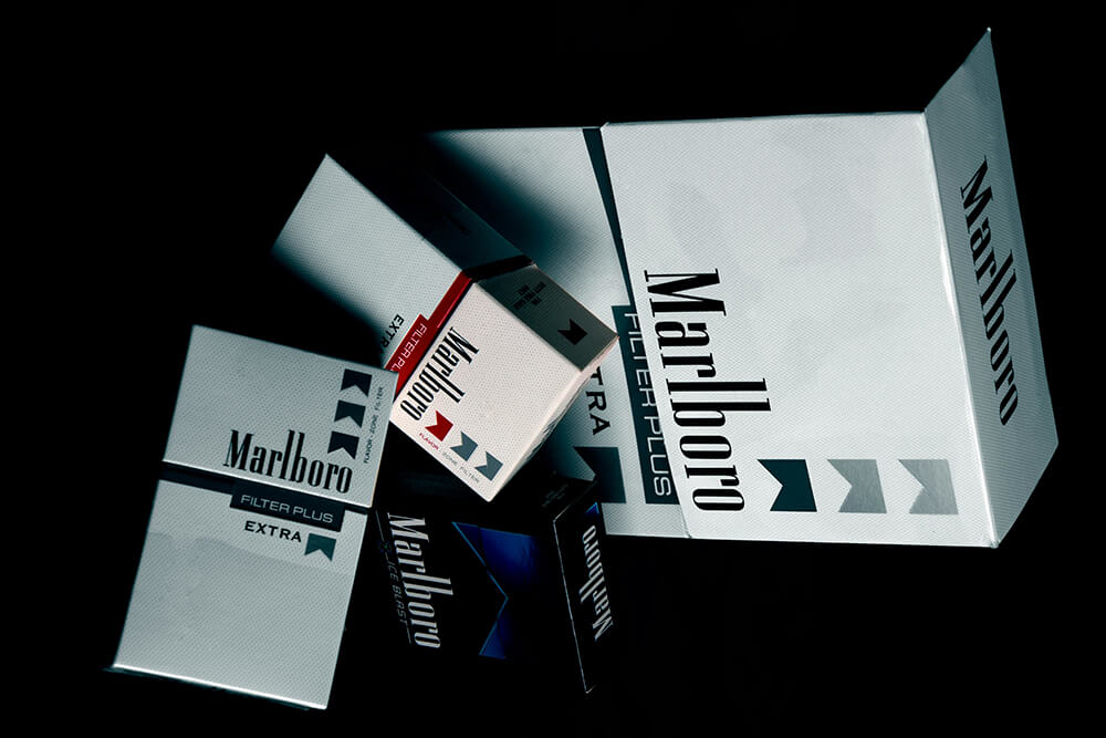 Premium Marlboro luxury rigid box packaging displayed in dramatic lighting.