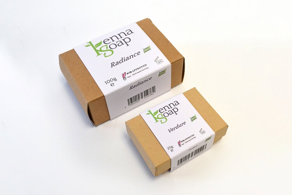 Soap products wrapped in recyclable cardboard sleeves with custom printed labels