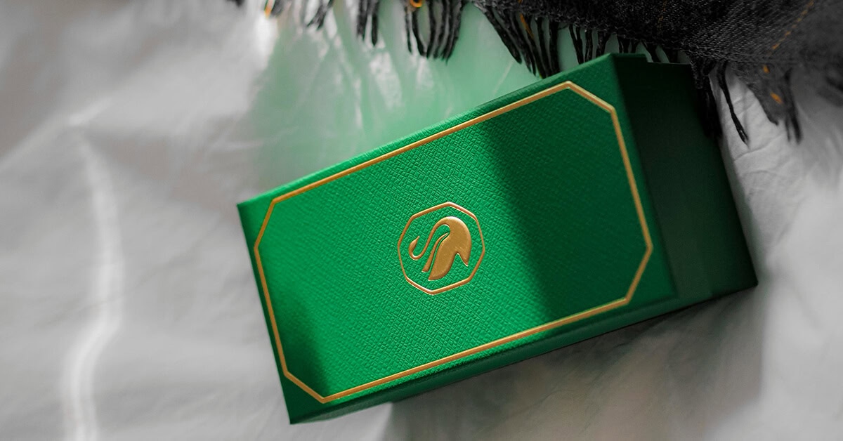 Premium green custom gift boxes with logo embossed, ideal for luxury branding.