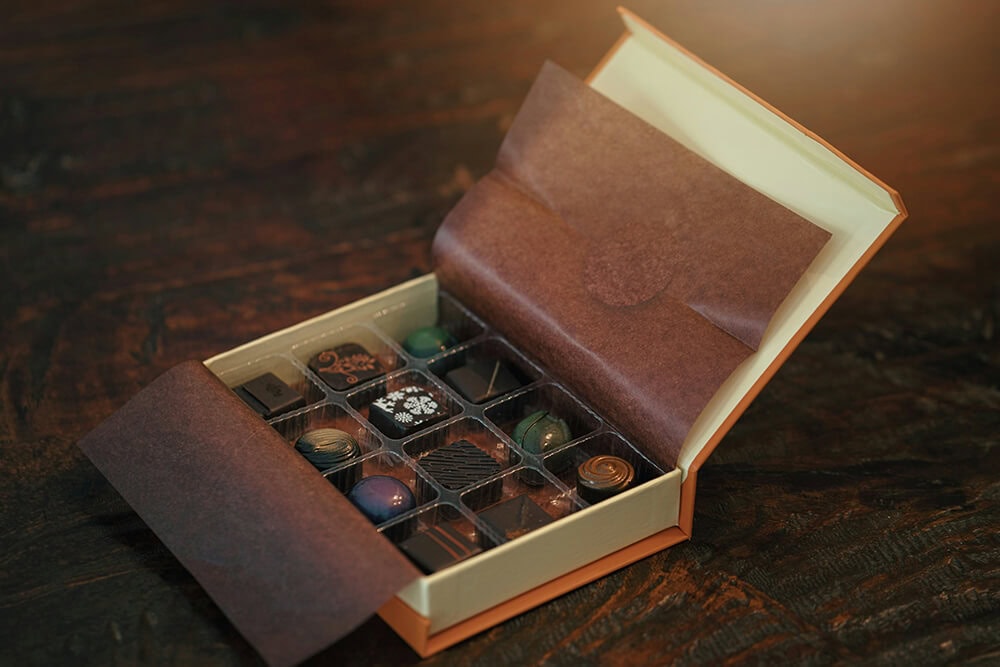 Open box of assorted chocolates.