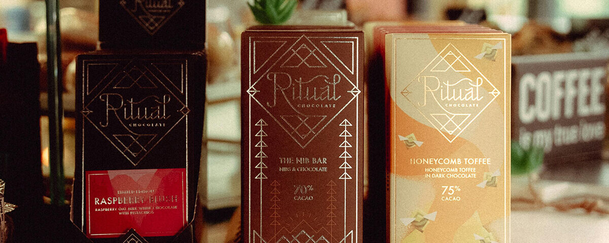 chocolate bar packaging ideas: Premium artisan chocolate bars displayed with elegant paper packaging designs.