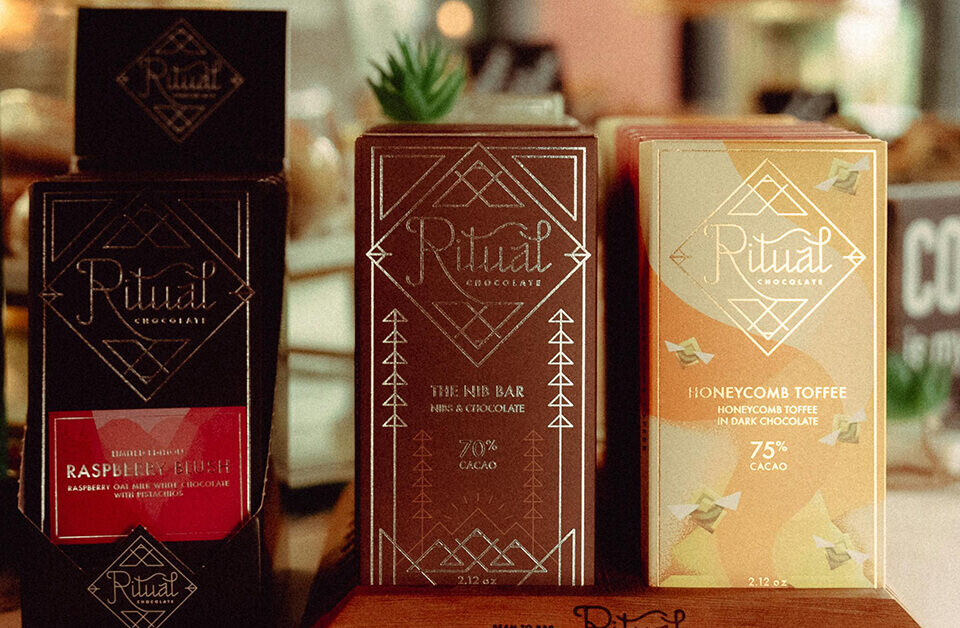 chocolate bar packaging ideas: Premium artisan chocolate bars displayed with elegant paper packaging designs.