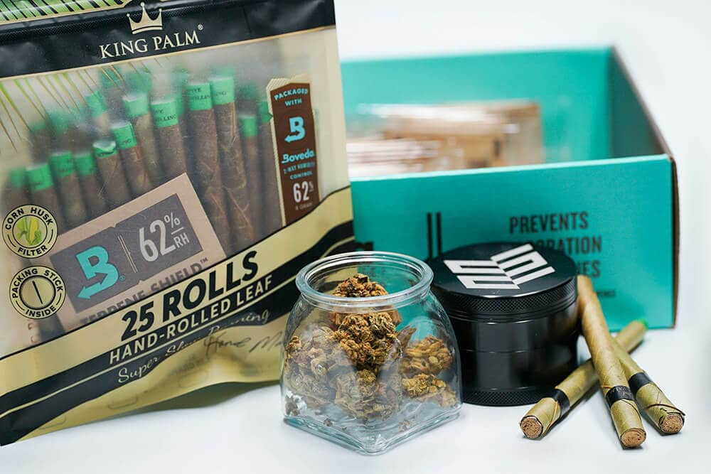 Cannabis products displayed with custom cannabis packaging boxes and branded containers.