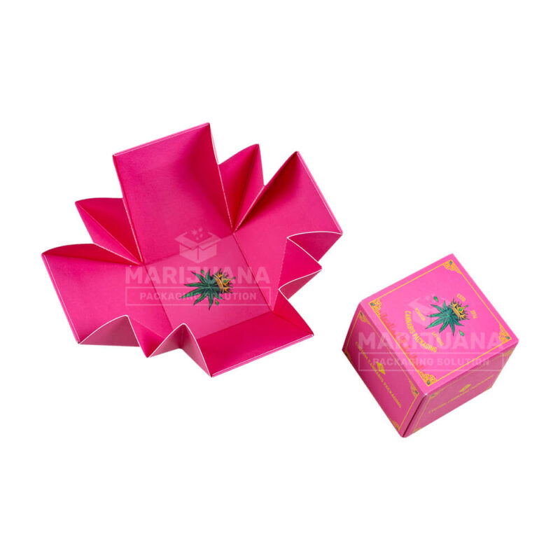 Interior of open pink custom CBD tincture box base insert with a printed cannabis leaf.