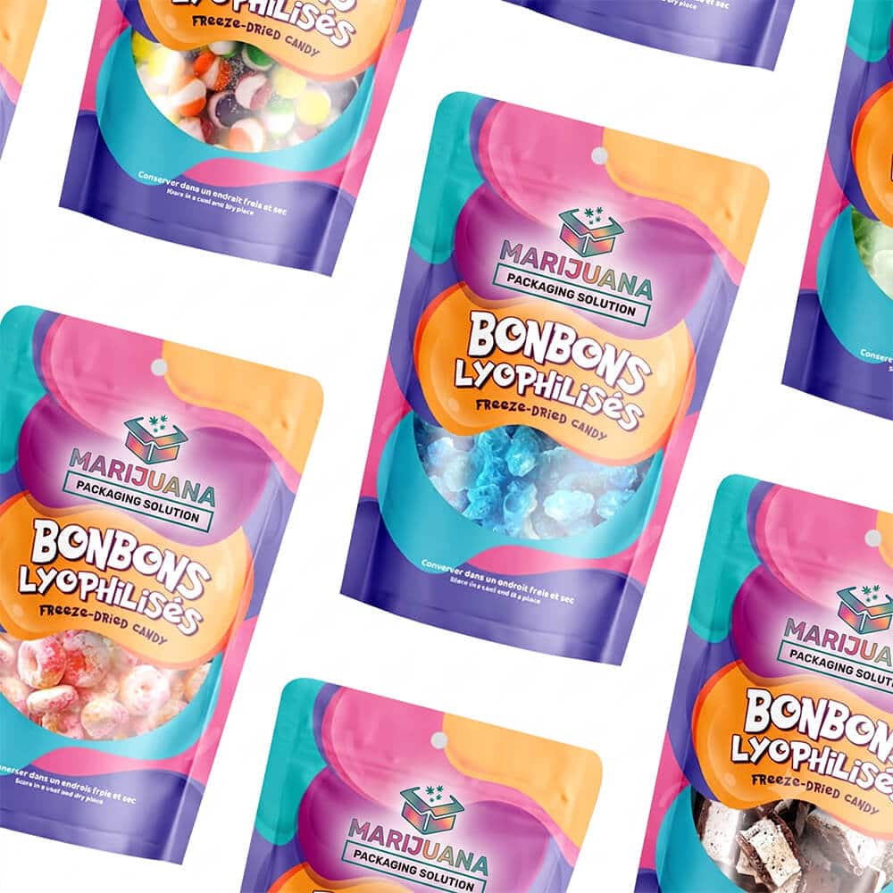 A diverse collection of colorful, custom-printed THC candy packaging bags scattered on a white background, highlighting various freeze-dried candy options.