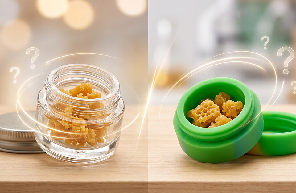 Split view on a wooden table comparing a clear glass jar of cannabis crumble wax packaging on the left and a green silicone container with similar wax on the right, both featuring floating question marks.